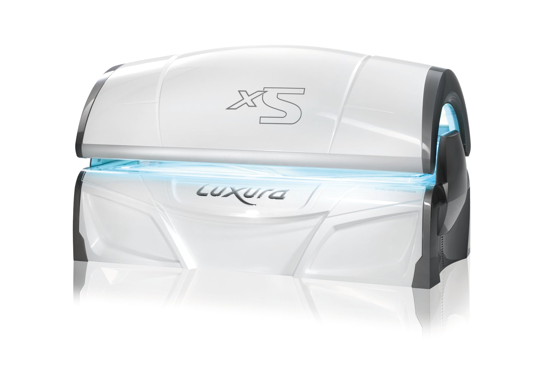 Front view of the Luxura X5 tanning bed with a white exterior, curved top canopy, and soft blue illumination from the internal lamps.