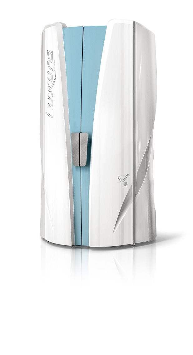Luxura V6 vertical tanning booth with glossy white exterior panels and a light blue centre section.