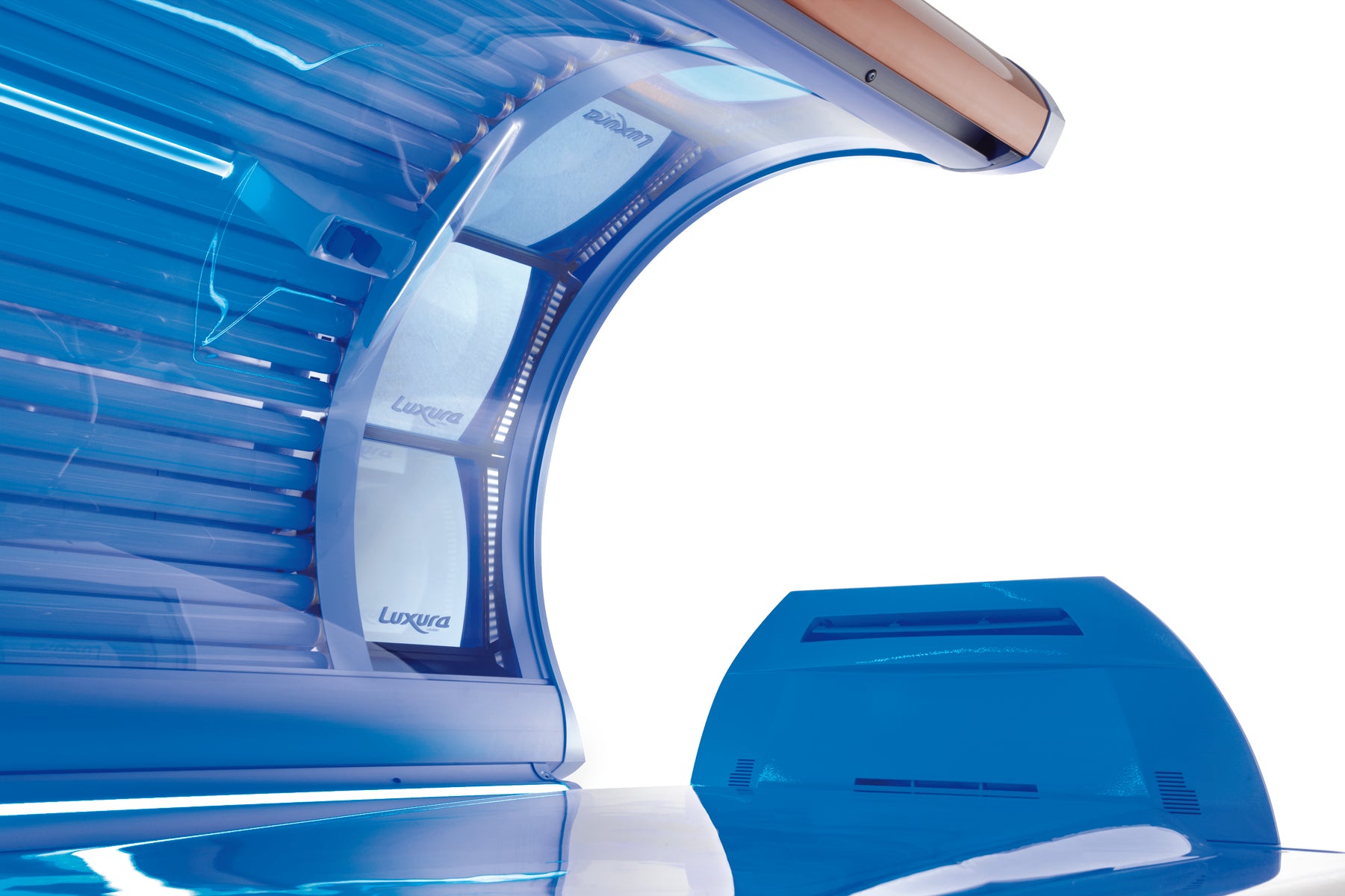 Close-up of the Luxura X7 shoulder tanner unit mounted above the tanning tubes, emitting focused blue UV light.