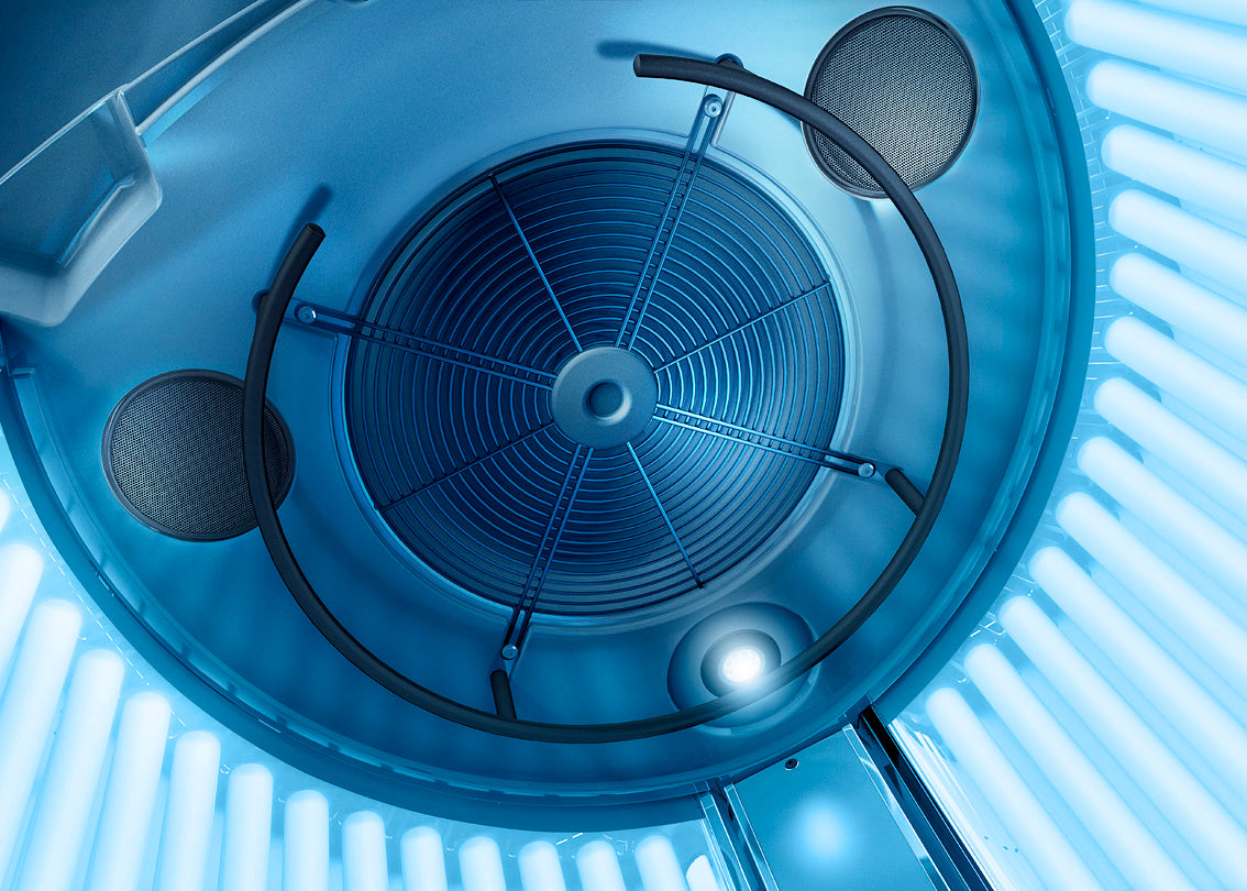 View of the Luxura V6 internal ceiling showing the ventilation fan, grip bars, and speaker system.