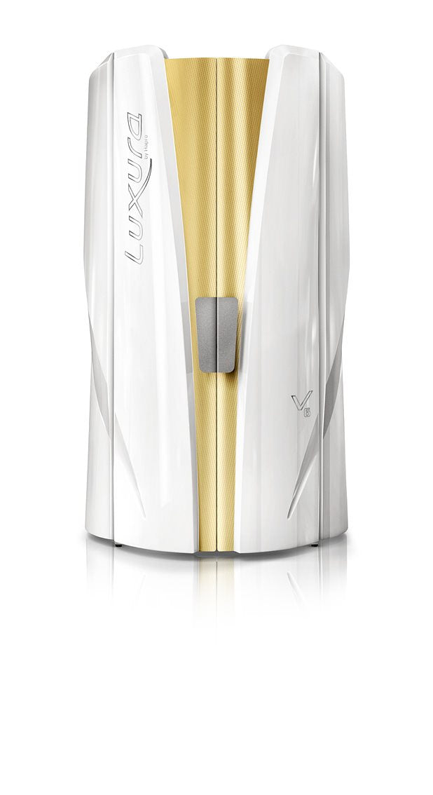 Luxura V6 vertical tanning booth with a white exterior and gold-toned centre panel.